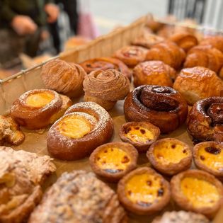 a tray full of hand made pastries