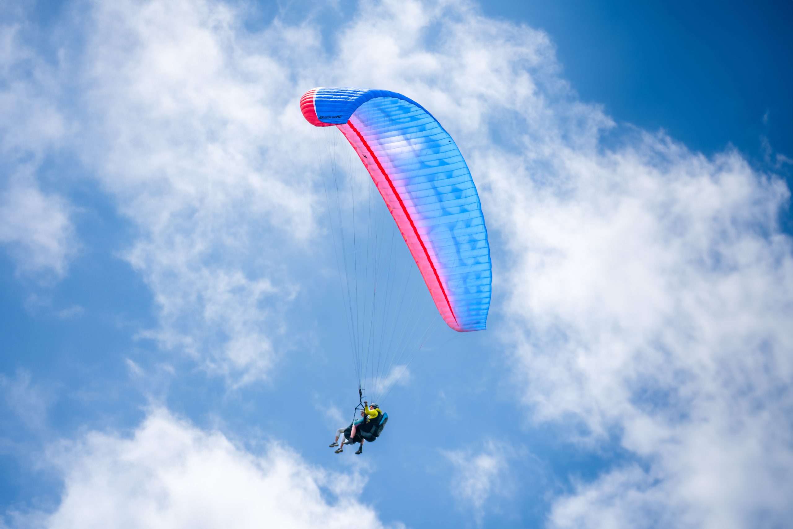 Tandem paragliding flight with panoramic views across the Bannau Brycheiniog landscape.