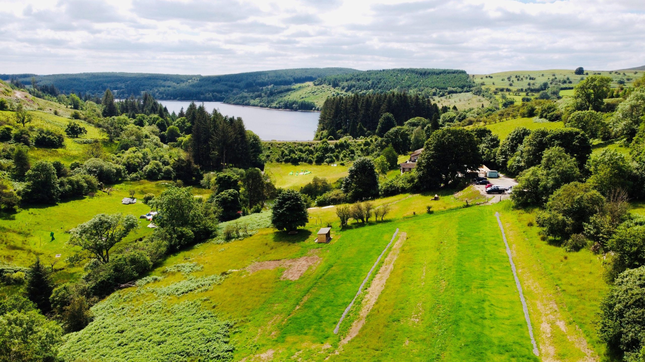 a birds eye view over teh campsite and across to teh reservoir