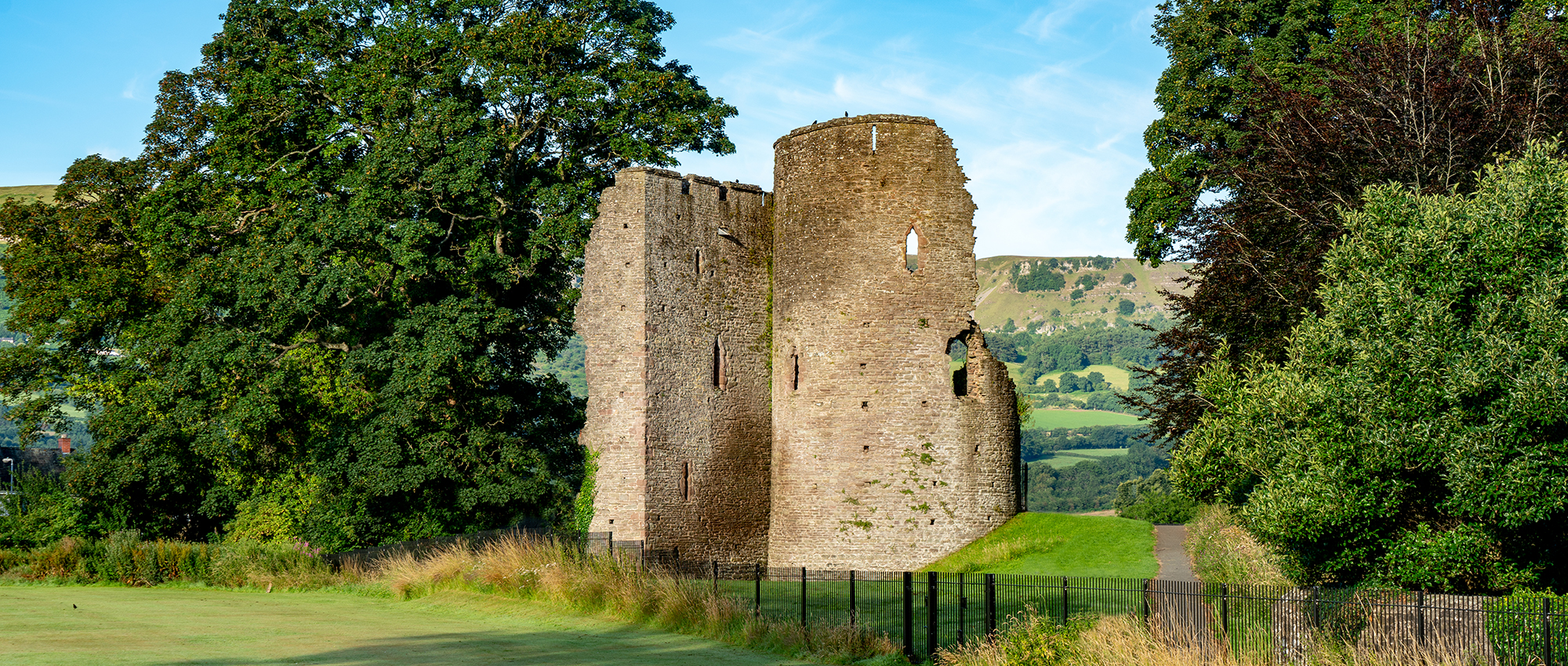 Ruins of Crickhowell Castle’s twin-towered gatehouse in Castle Park