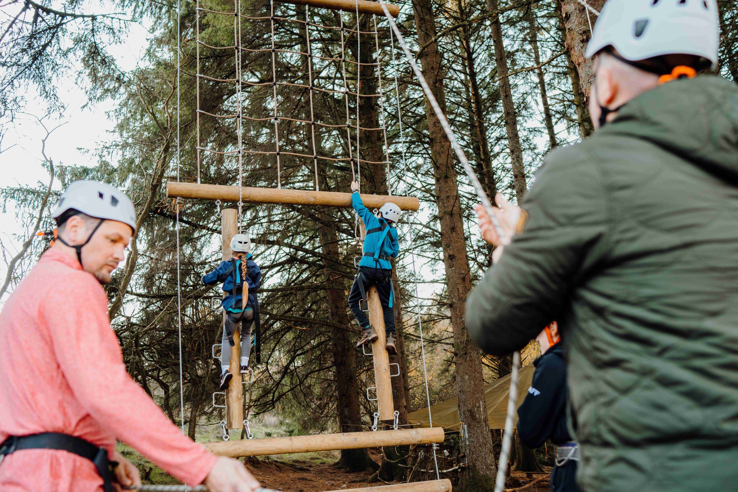 a high ropes course for people to climb in the tree areas safely and under instructiuon