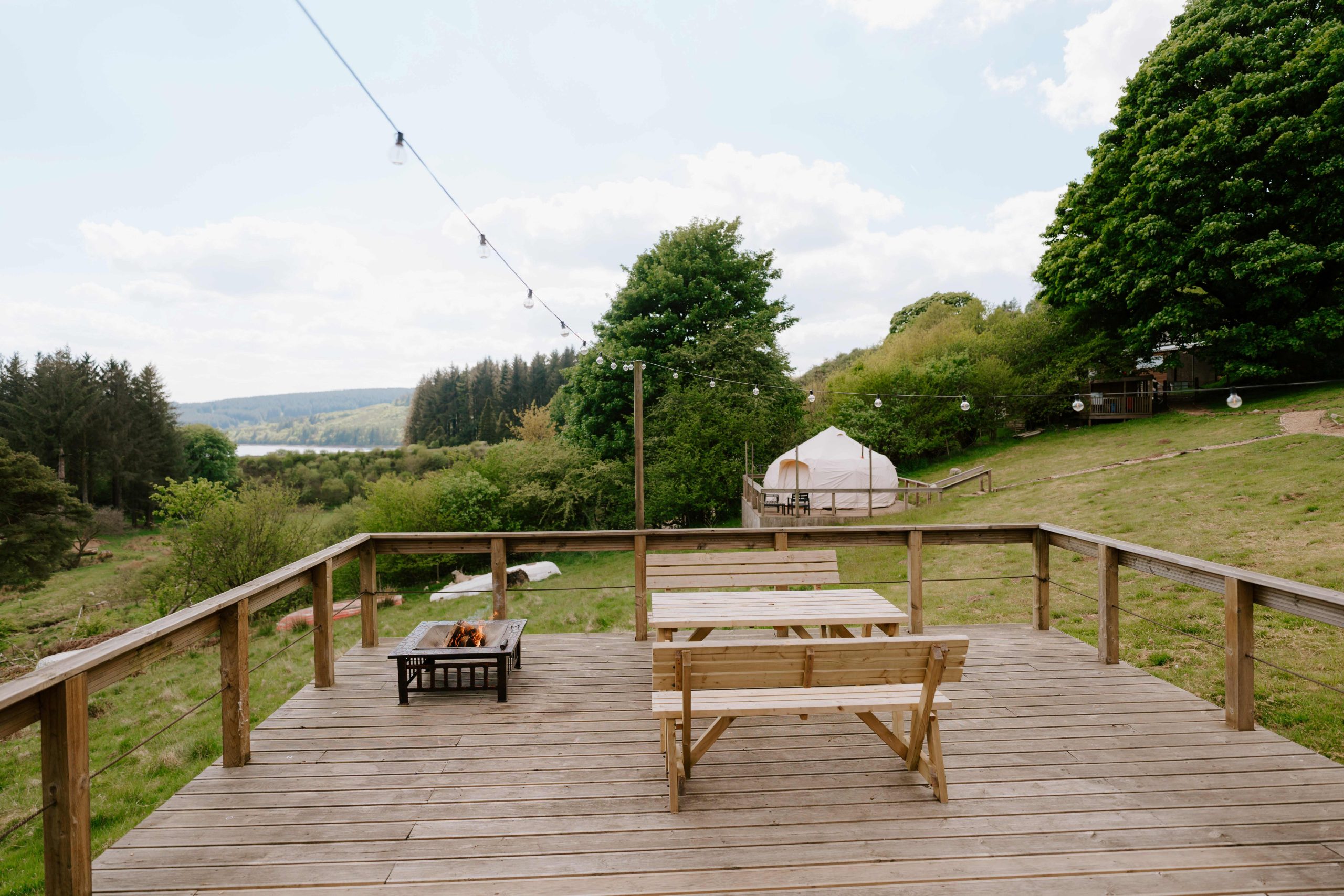 a view from the inside of the pod across the decking area