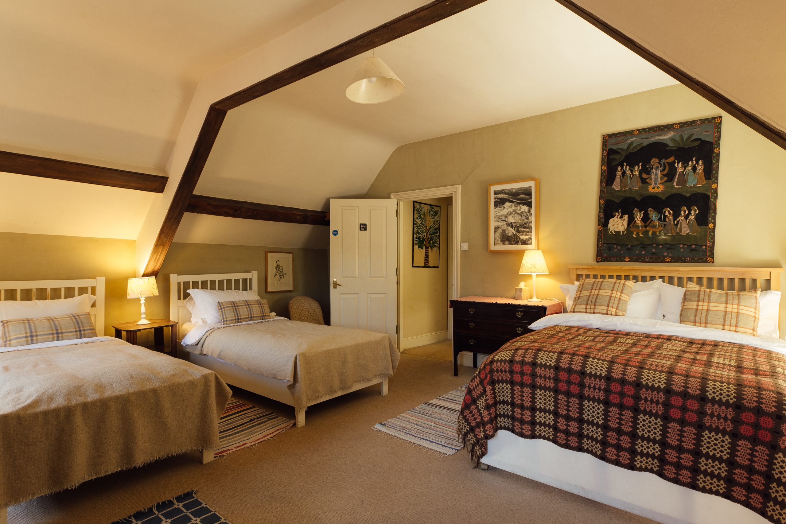 nder the eaves sleeping space for guests a double and two single beds, a good space for a family