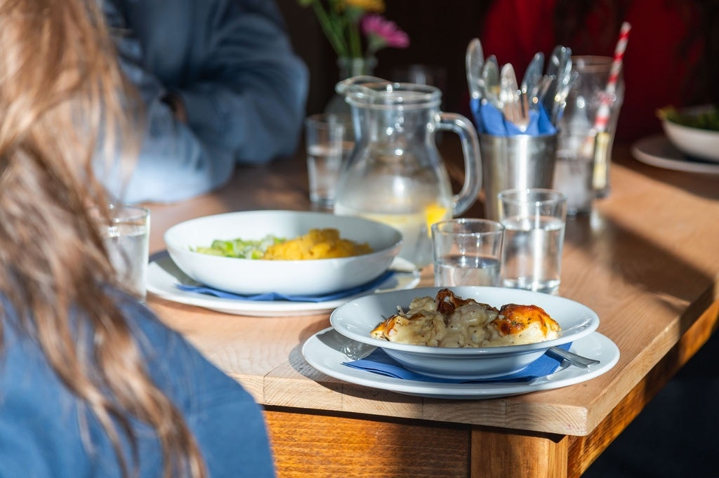 people enjoying a lunch in the sun at Brecon Tap