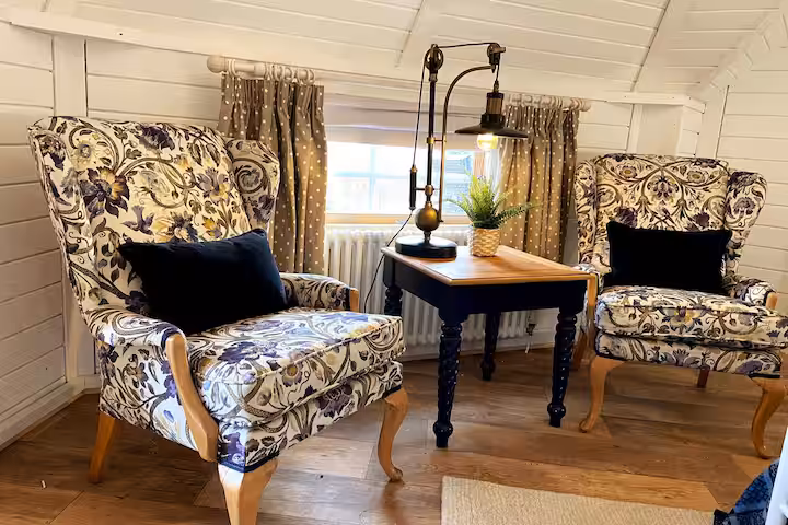 Open-plan living and sleeping space at Flora’s Cabin, part of the Pencerrig Collection