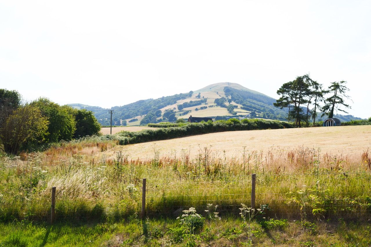 Rolling hills and farmland surrounding Pwll Court Retreat in the Bannau Brycheiniog National Park.
