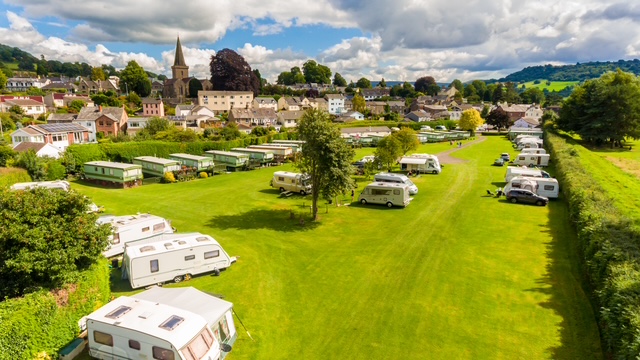 Touring caravans and motorhomes at Riverside Caravan Park, Crickhowell, Brecon Beacons