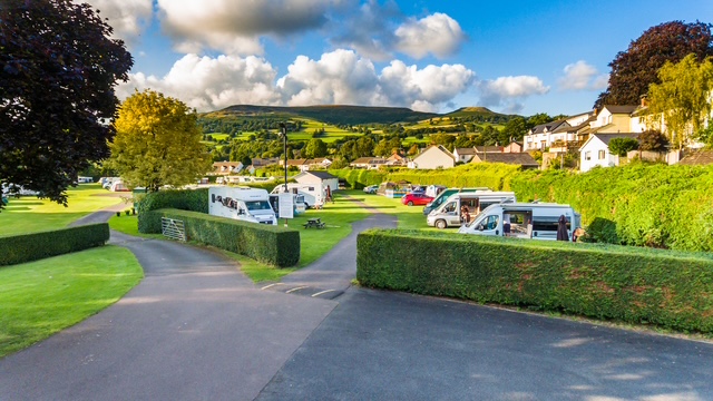 Touring caravans and motorhomes at Riverside Caravan Park, Crickhowell, Bannau Brycheiniog