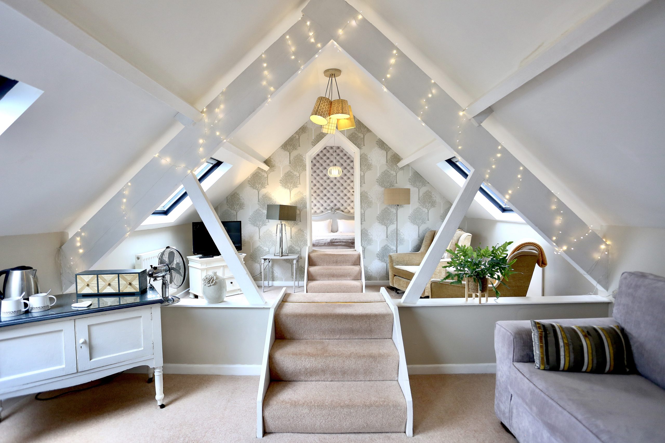 Bright bedroom at Ty Croeso with modern en-suite facilities.