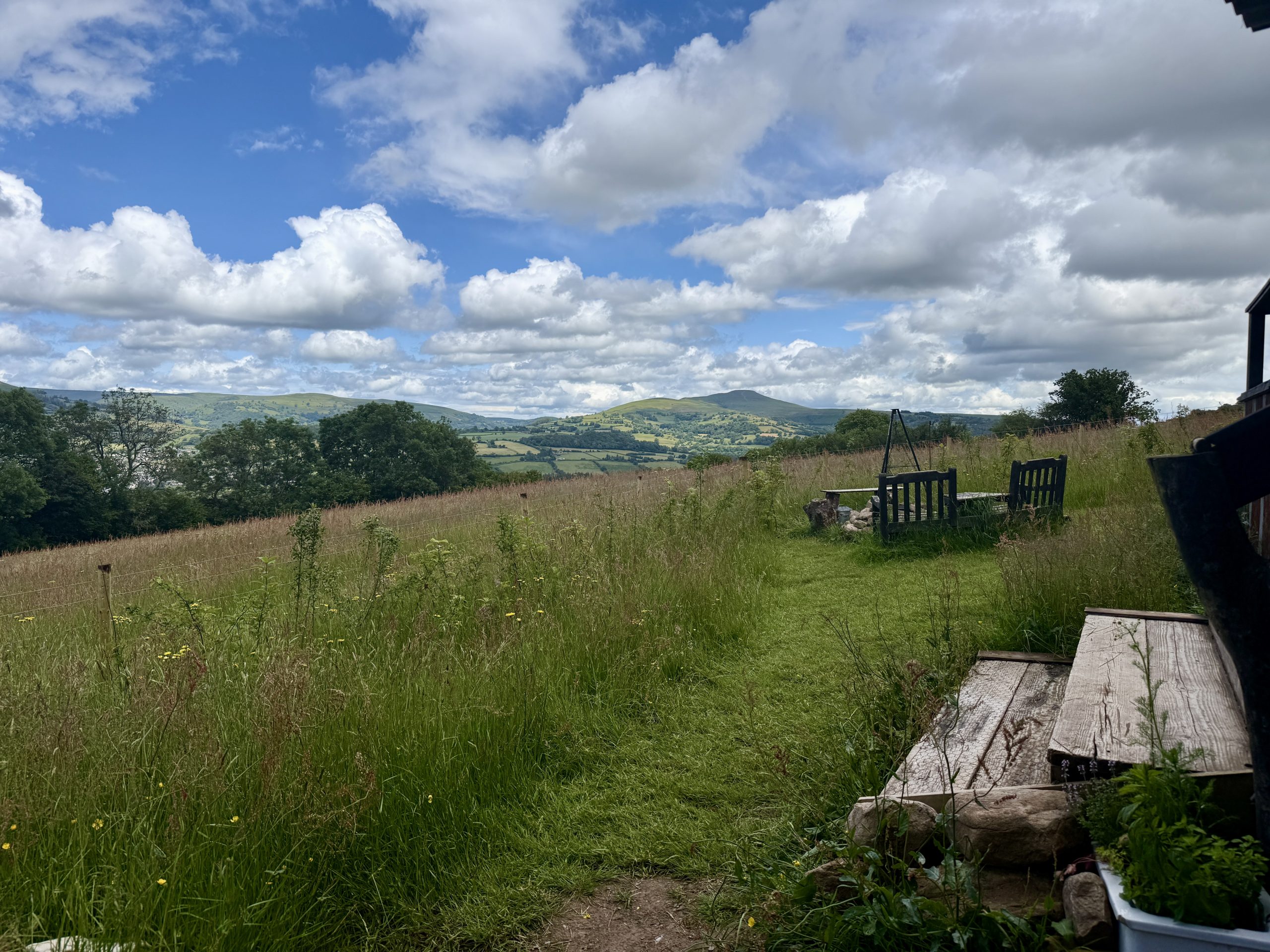 Caban Tarren surrounded by rolling countryside in Bannau Brycheiniog