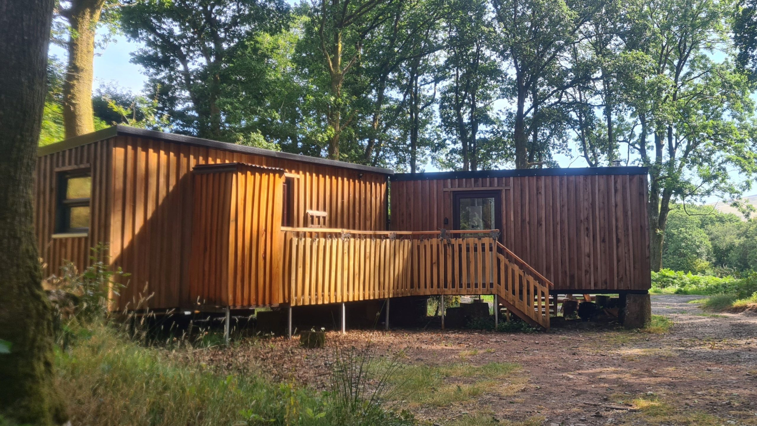Coed Yr Henbont Cabin surrounded by ancient woodland in Bannau Brycheiniog National Park.