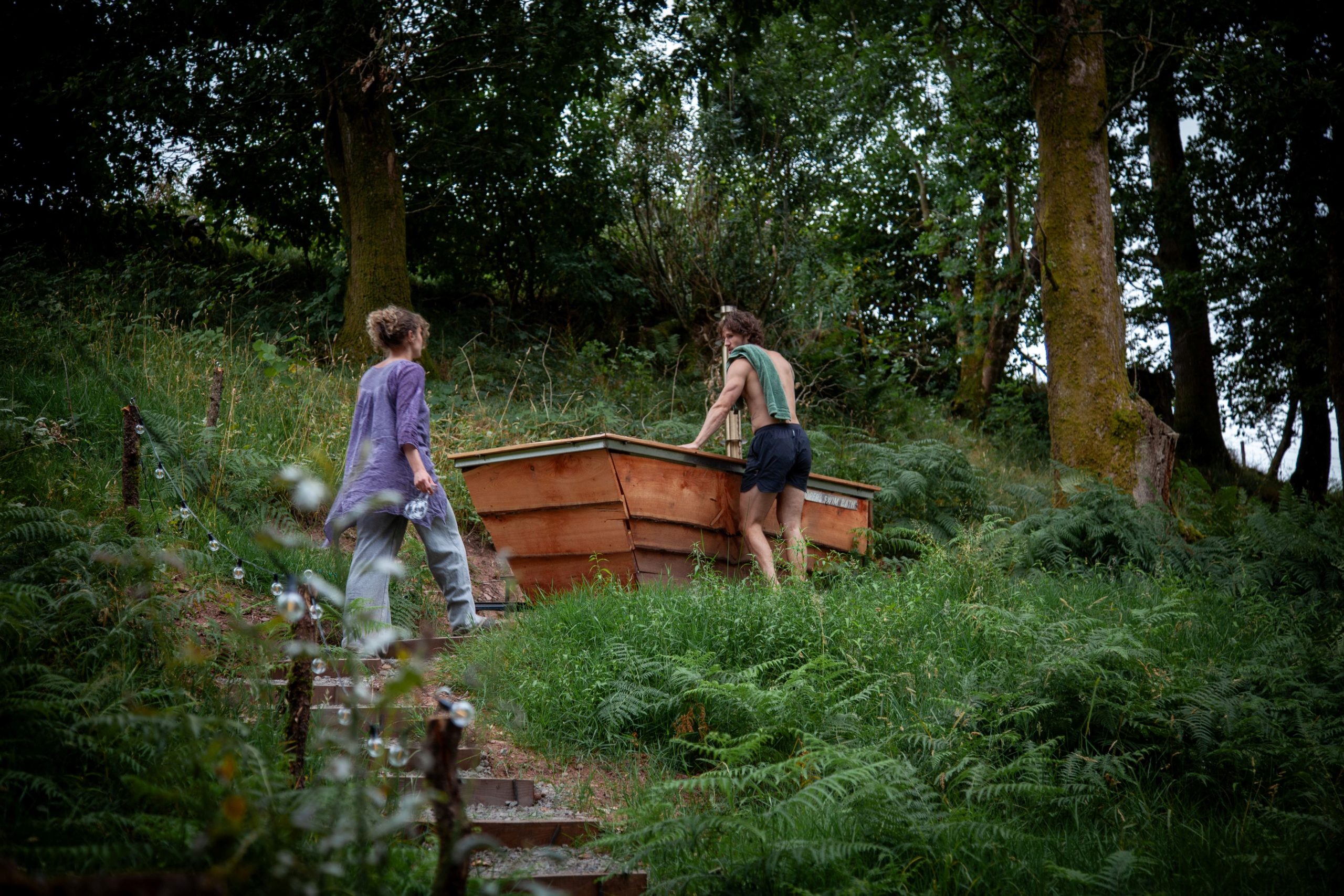 Wood-fired hot tub nestled amongst mature woodland at Henbont Holidays.